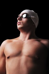 Male swimmer isolated on black
