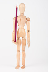 Small wood mannequin standing with colour pencil isolated on whi