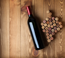 Red wine bottle and grape shaped corks
