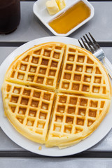 fresh waffle  in white plate on the table