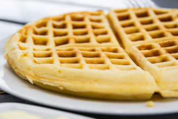 fresh waffle  in white plate on the table