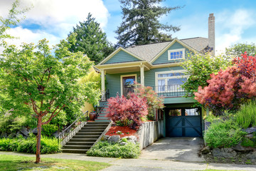 House exterior. View of entrance porch and garage