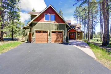 House exterior. View of garage and driveway