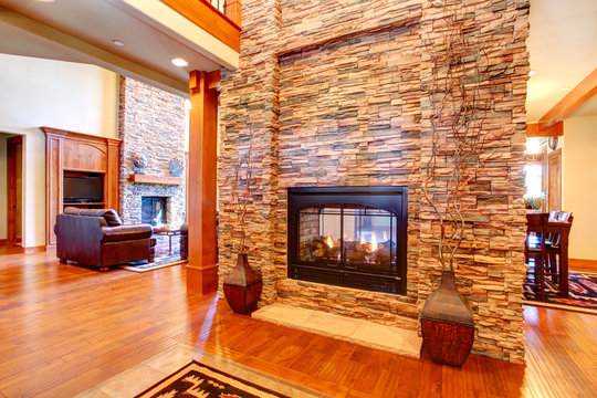 Luxury House Interior. Stone Wall With Fireplace