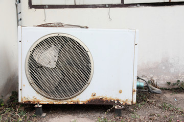 Old air compressors is located behind the building.