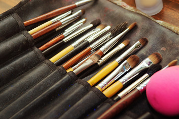 Closeup of makeup tools in their holder