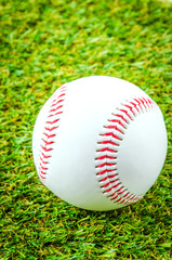 Baseball on green grass