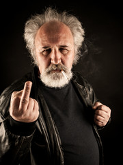Grumpy man showing middle finger