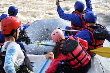 Rafting, splashing the white water, close up