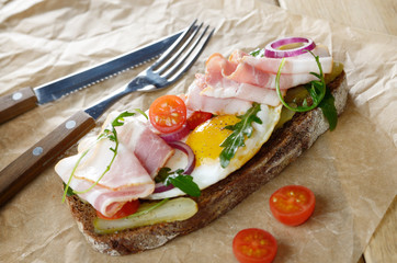 Bacon and fried egg open sandwich