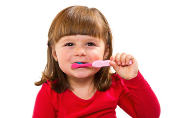 bambina che si lava dei denti