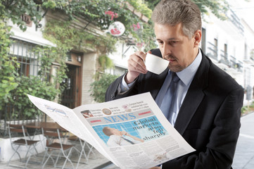 Businessman reading a newspaper
