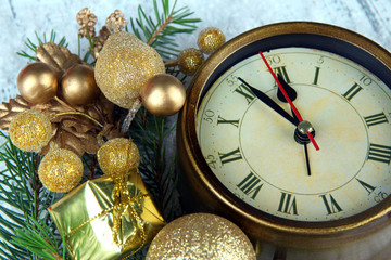 Fototapeta na wymiar Clock with fir branches and Christmas decorations