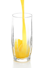 Juice pouring into glass isolated on white