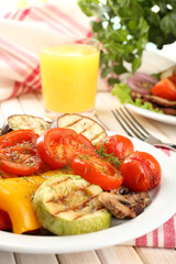 Delicious grilled vegetables on plate on table close-up