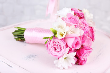 Beautiful wedding bouquet on wooden chair