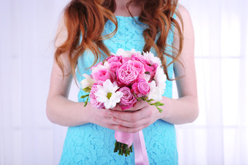 Woman hands holding beautiful wedding bouquet