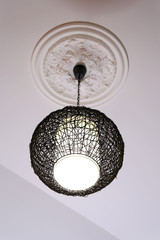 Modern chandelier hanging from ceiling