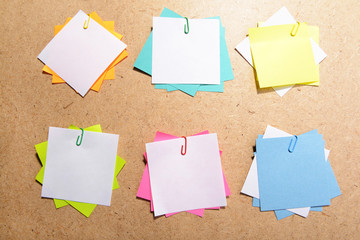 Empty paper sheets on wooden background