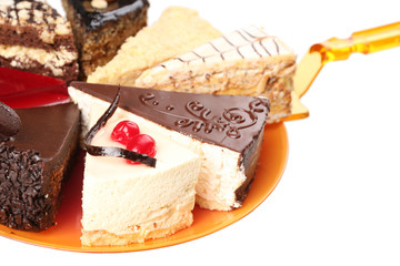 Assortment of pieces of cake, isolated on white © Africa Studio