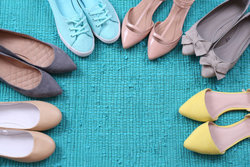 Female fashion shoes on blue carpet