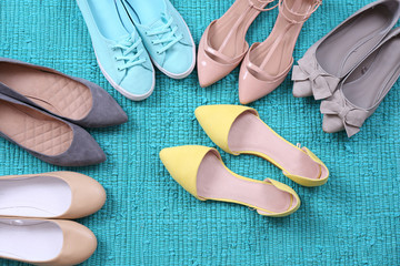 Fototapeta na wymiar Female fashion shoes on blue carpet
