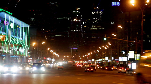 Steam of cars on the night street of the big city