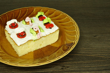 Slice cake topping as fruit and animal