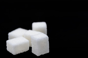 Sugar cubes on black
