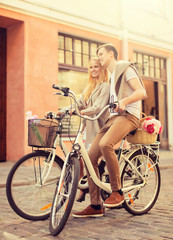 couple with bicycles in the city