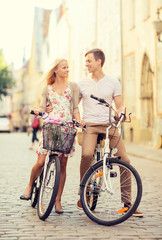 couple with bicycles in the city