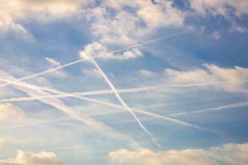 Fototapeta na wymiar Blue sky with plane trails
