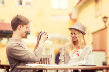 couple taking photo picture in cafe