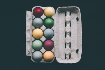 pastel colored easter eggs in a box