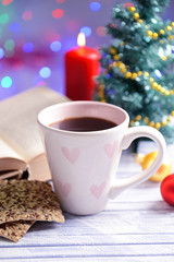 Composition of book with cup of coffee and Christmas