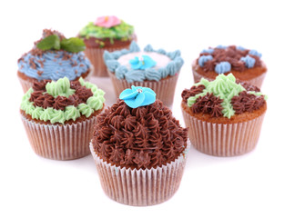 Tasty cupcakes with butter cream, isolated on white
