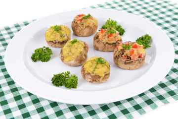 Stuffed mushrooms on plate on table close-up