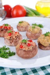 Stuffed mushrooms on plate on table close-up