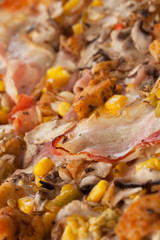 Fresh tasty pizza close up with sausage, corn, pepper and cheese