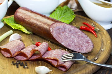 sausage on a wooden plate in a restaurant