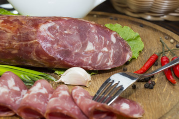 sausage on a wooden plate in a restaurant
