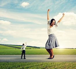 man screaming at joyful businesswoman