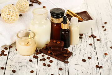 Beautiful chocolate spa setting on wooden table close-up