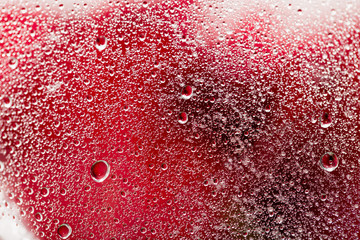 water droplets on a red background. macro