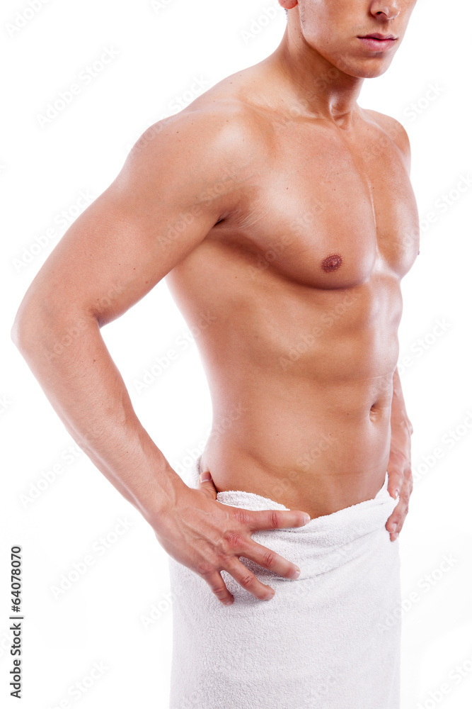 Wall mural handsome muscular man in towel, isolated on white