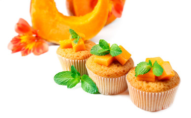 Tasty pumpkin muffins, isolated on white