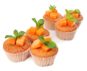 Tasty pumpkin muffins, isolated on white