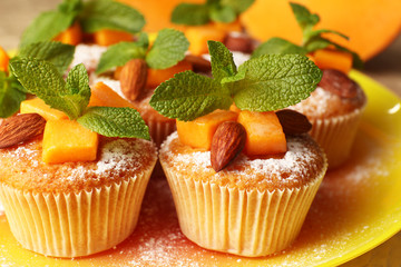 Tasty pumpkin muffins, close up
