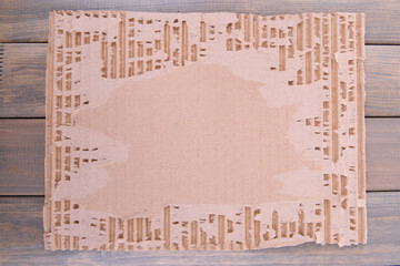 Cardboard on wooden background