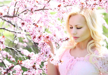 Obraz na płótnie Canvas Blonde Girl with Cherry Blossom. Spring Portrait.